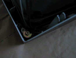Screws holding monitor to front of case.